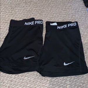 Two pairs of black Nike Pro spandex